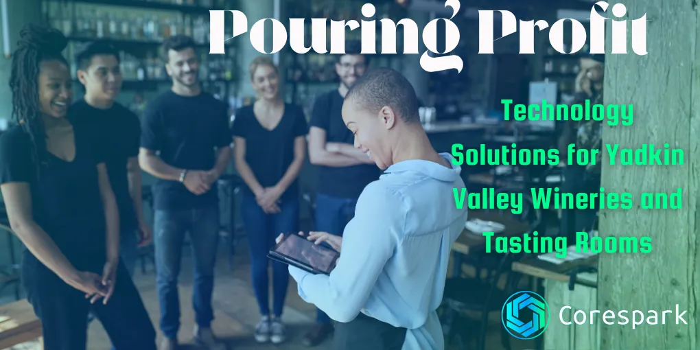 A tasting room manager using a tablet to manage reservations at a Yadkin Valley NC winery, representing technology solutions for wine country hospitality businesses.