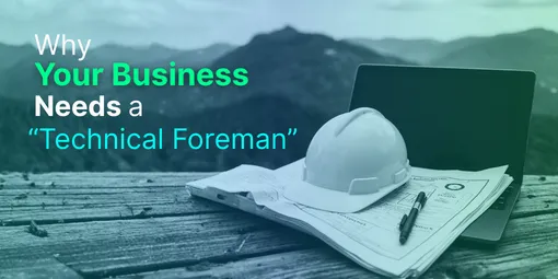 A pair of blueprints and a hard hat resting on a laptop, symbolizing the blend of construction management and technology.